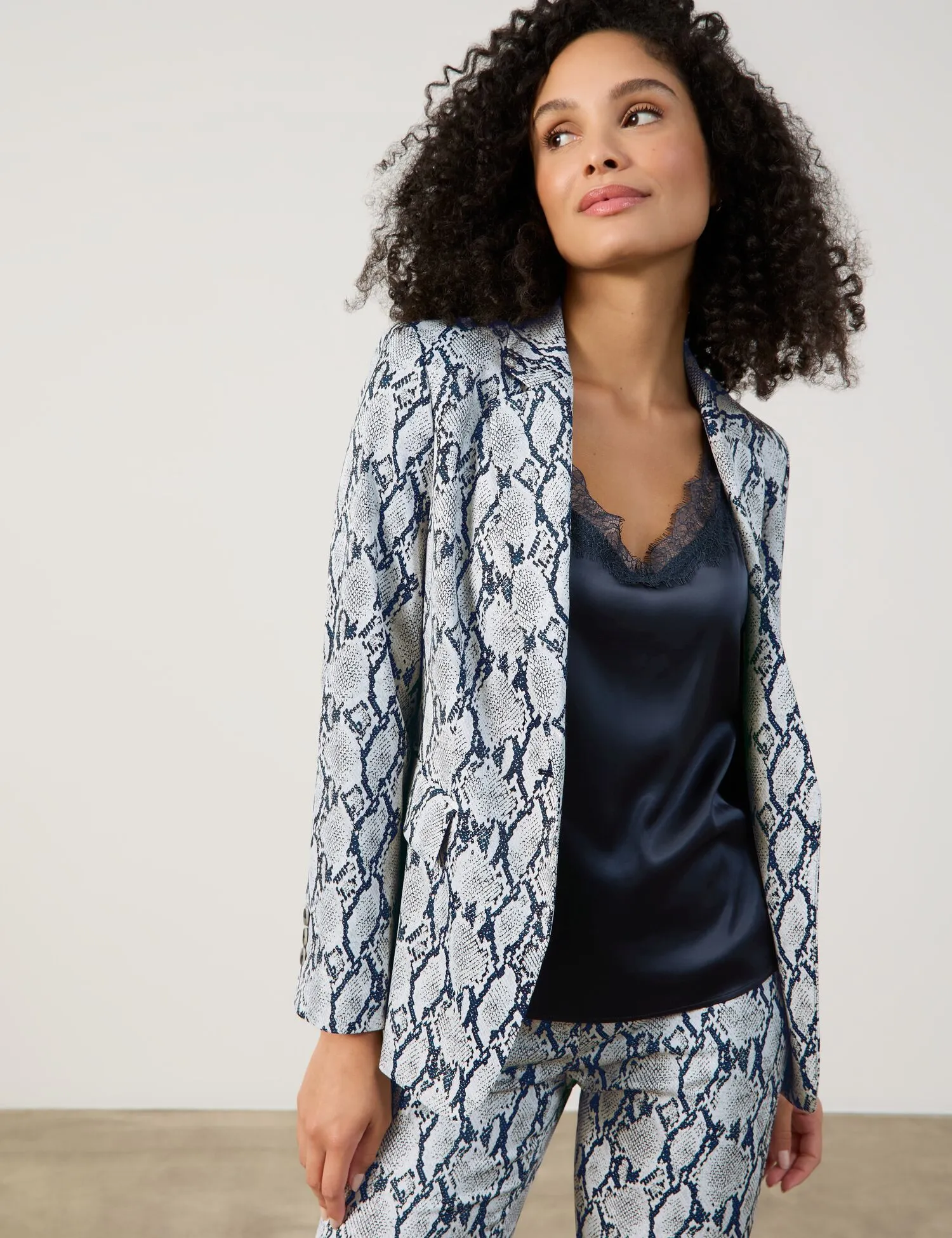 Fashionable blazer with a snakeskin pattern