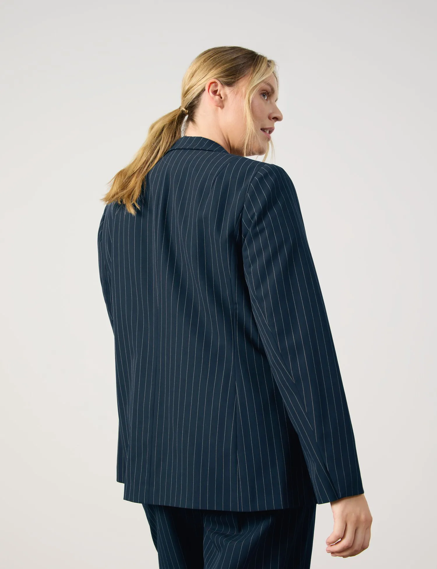 Figure-skimming blazer with fine pinstripes