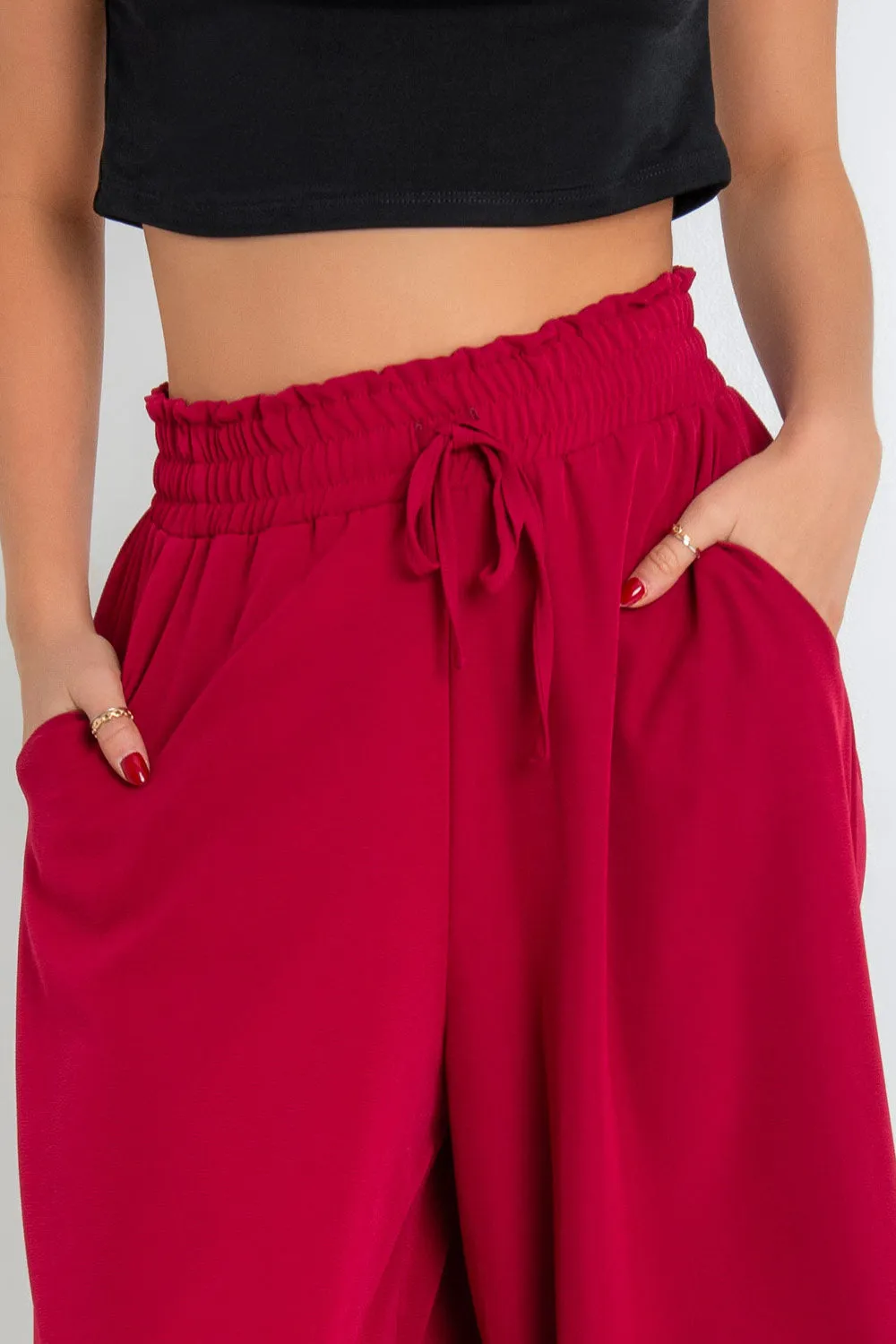 Pantalón fluido de fit palazzo con jareta