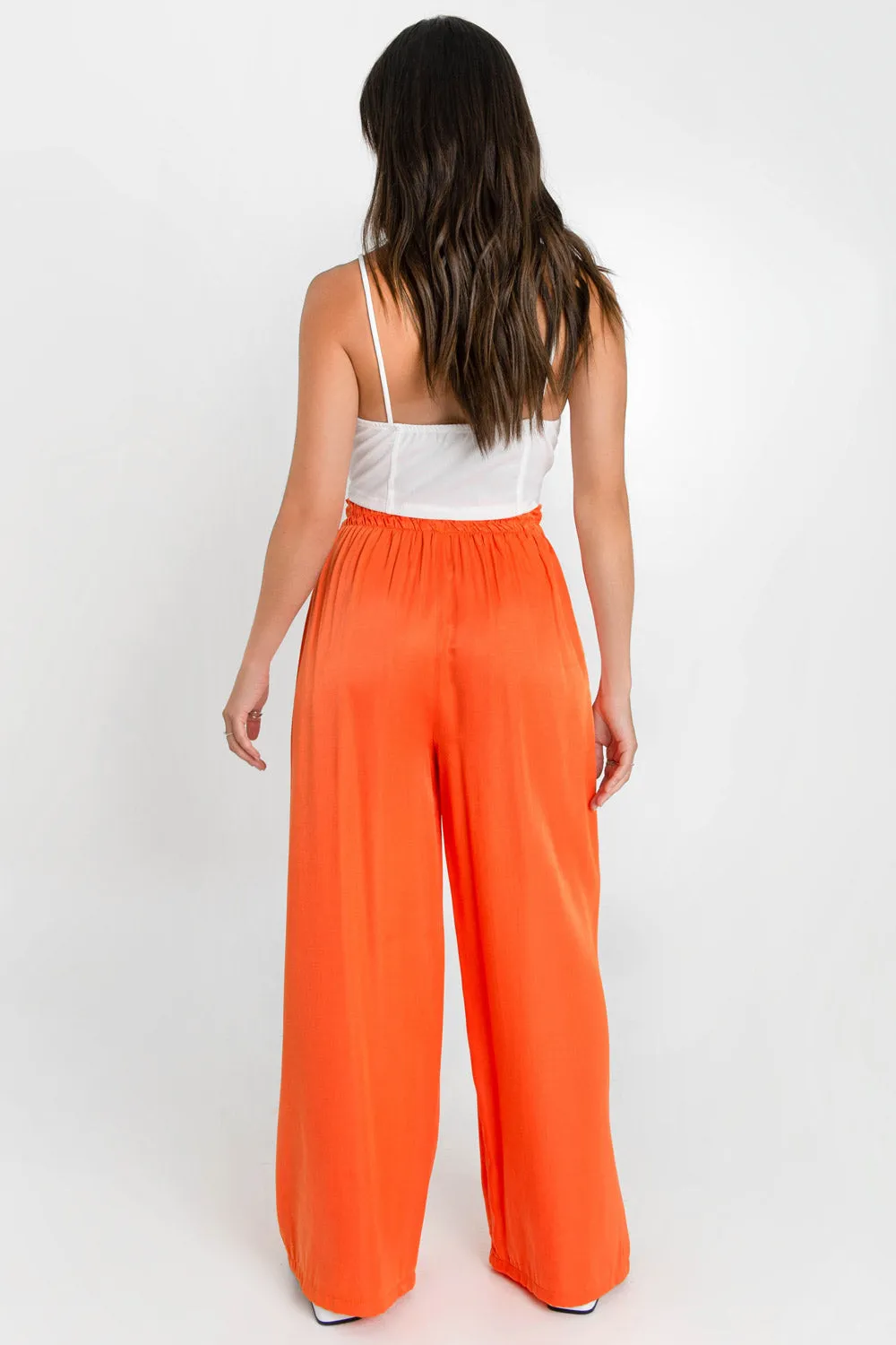 Pantalón fluido fit wide leg cintura alta elástica